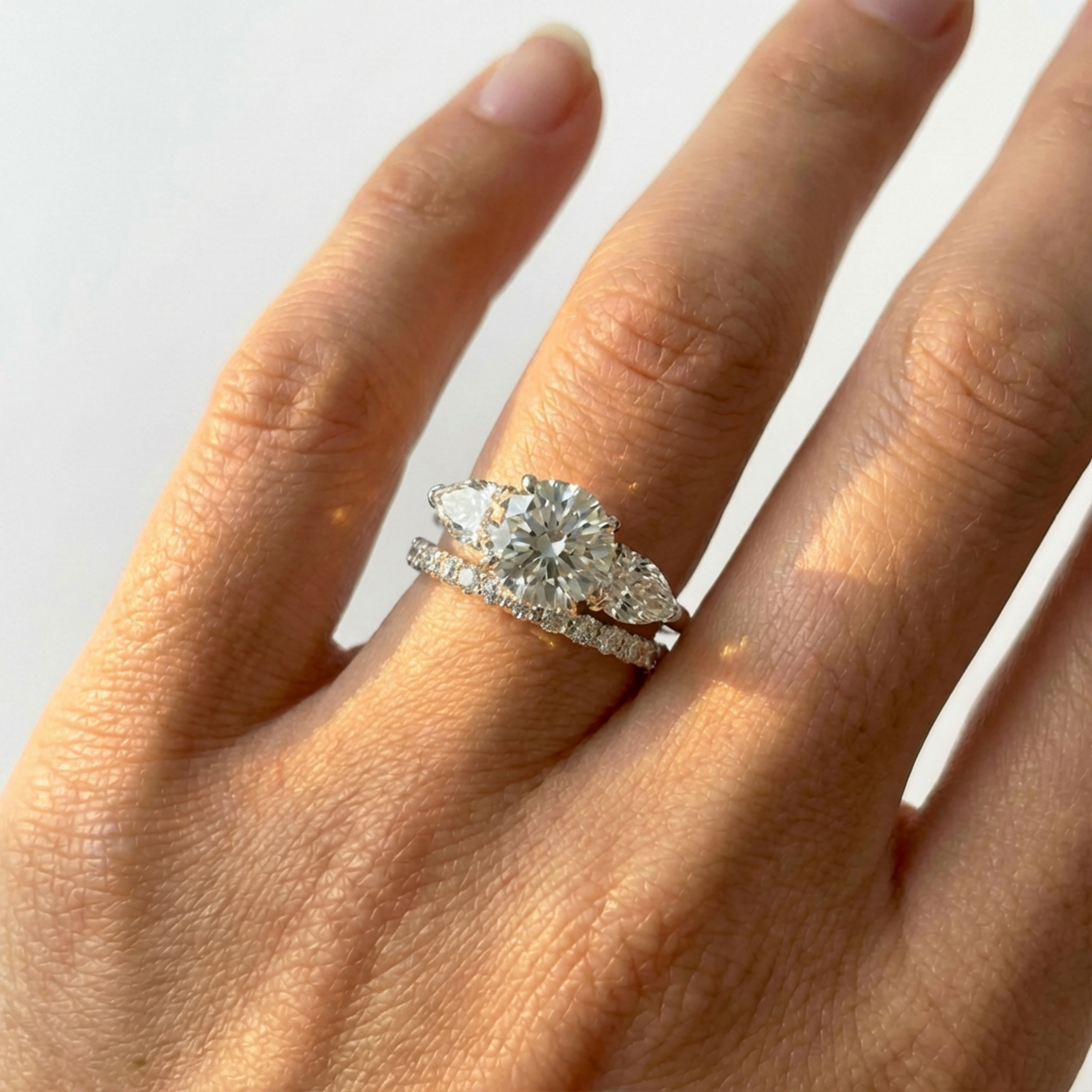 Round Diamond Trilogy Ring with Pear Side Stones