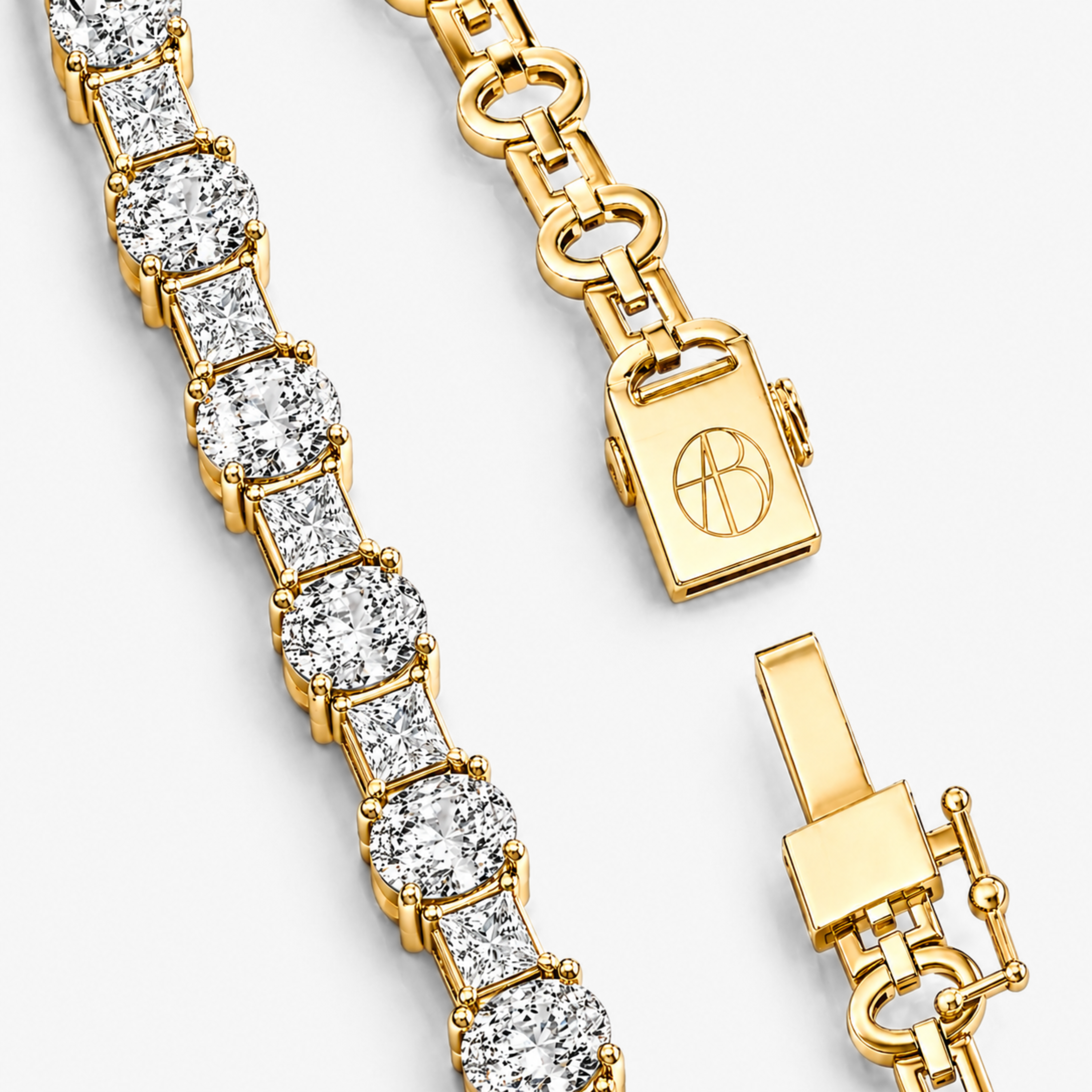 Close-up of oval and princess diamond tennis bracelet clasp in yellow gold