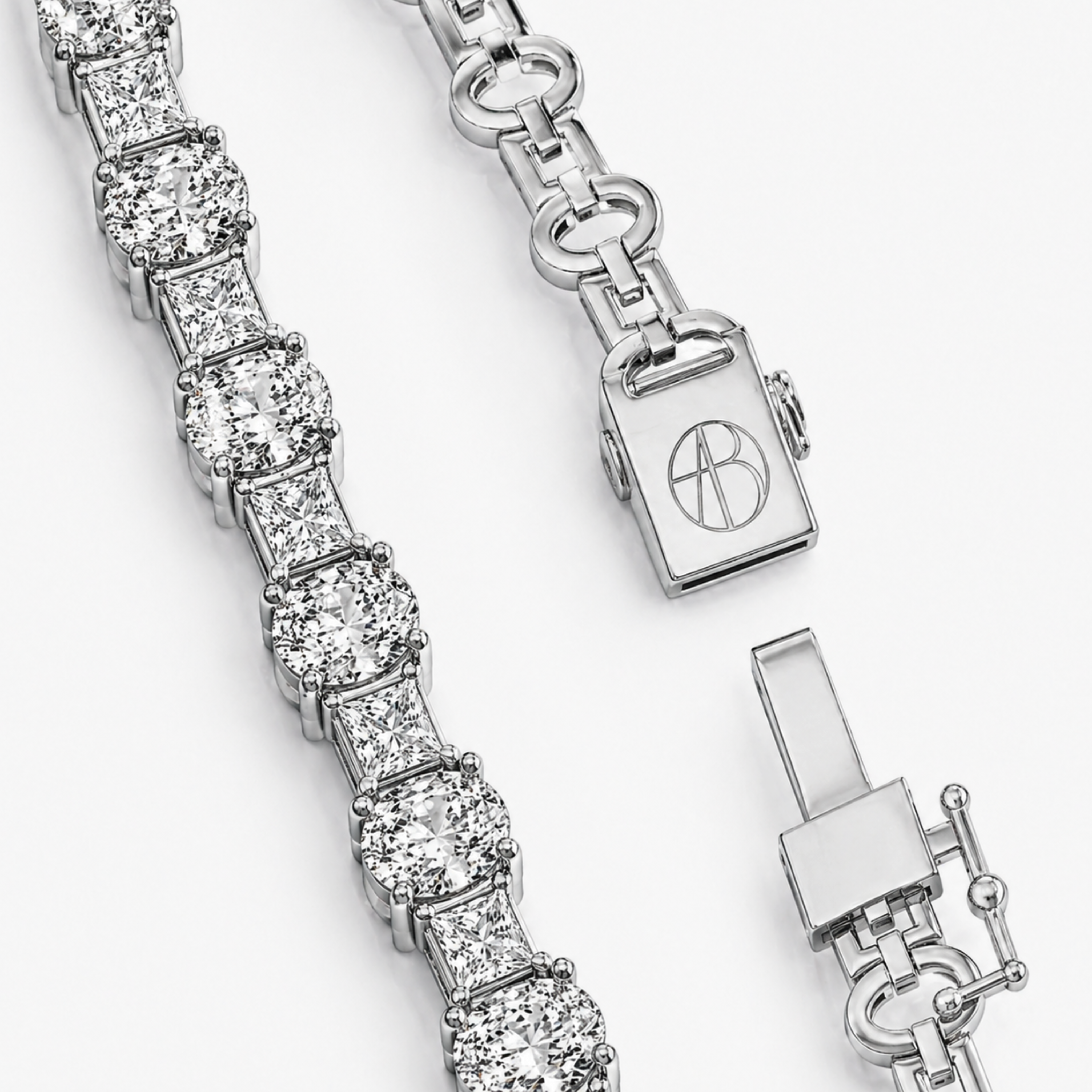 Close-up of oval and princess diamond tennis bracelet clasp in white gold