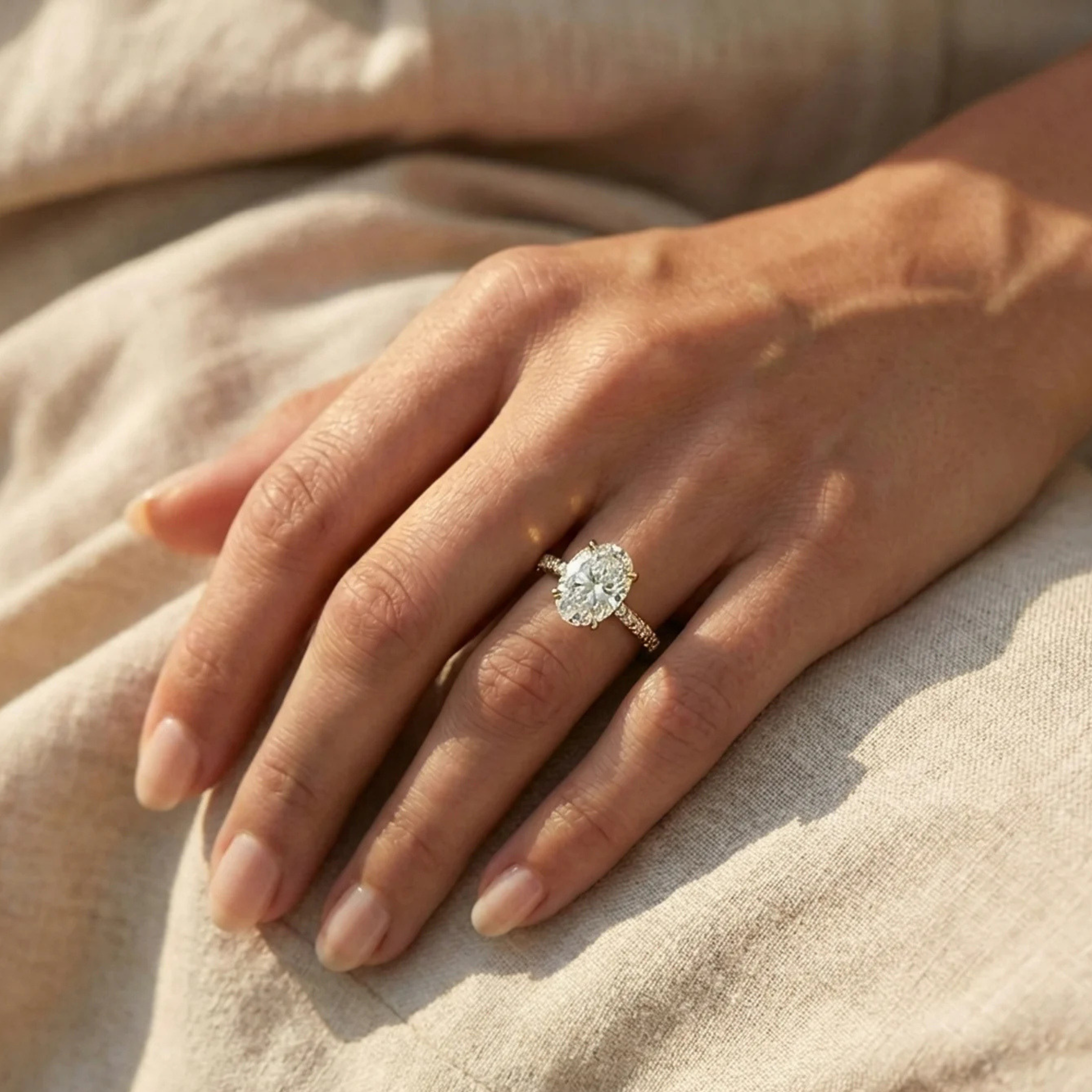 Oval Diamond Engagement Ring with Pavé Band and Hidden Halo