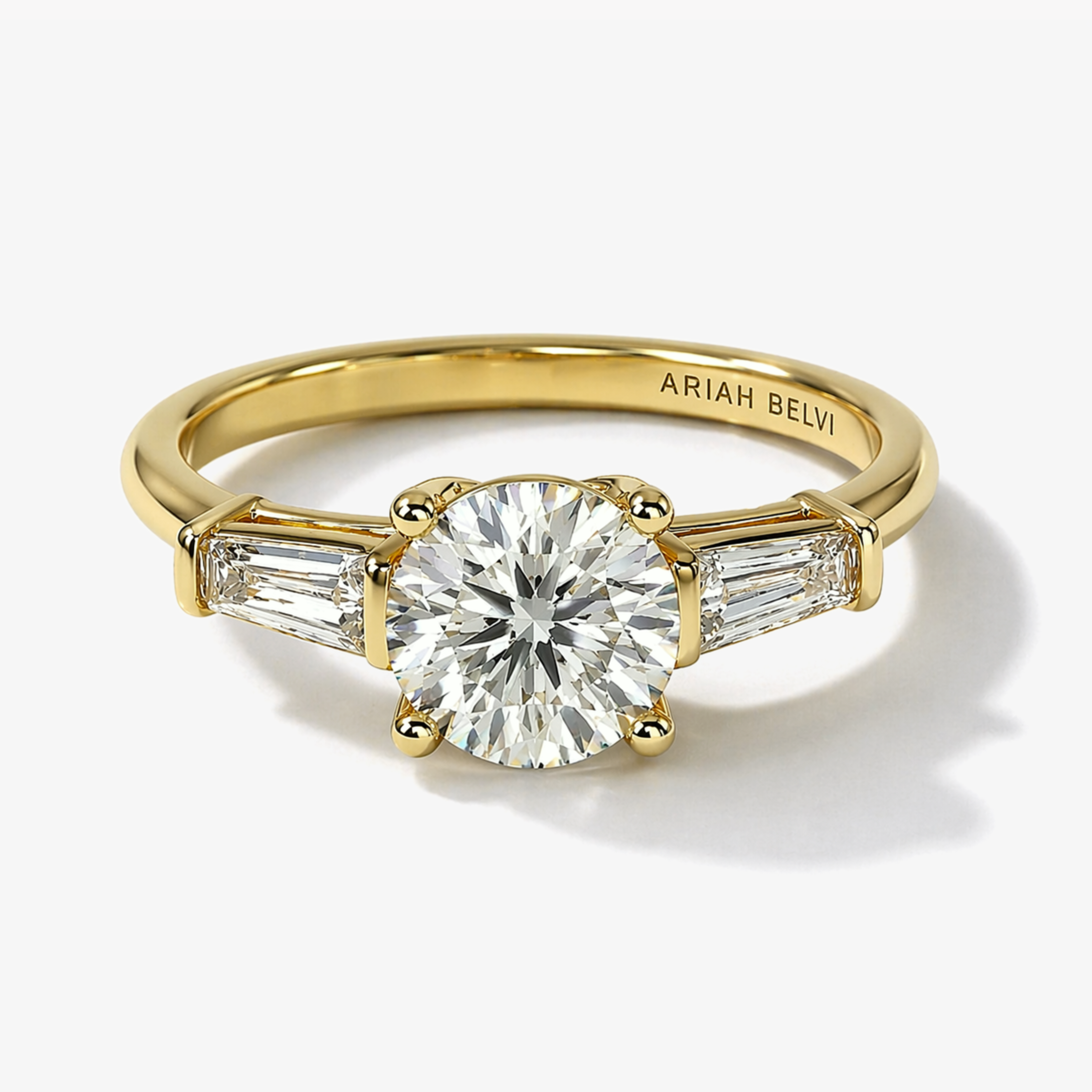 Round Brilliant Diamond Trilogy Ring with Tapered Baguette Side Stones