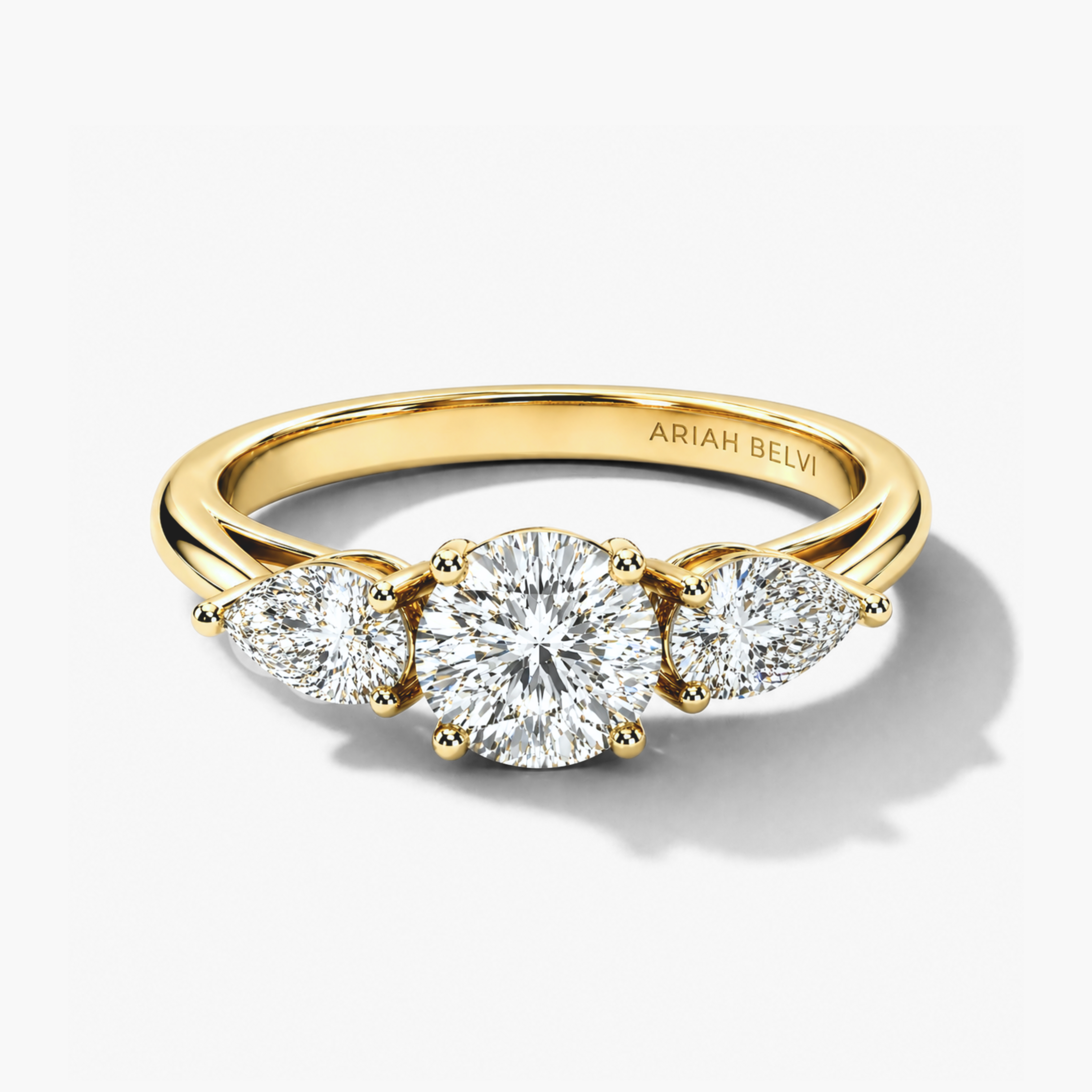 Round Diamond Trilogy Ring with Pear Side Stones