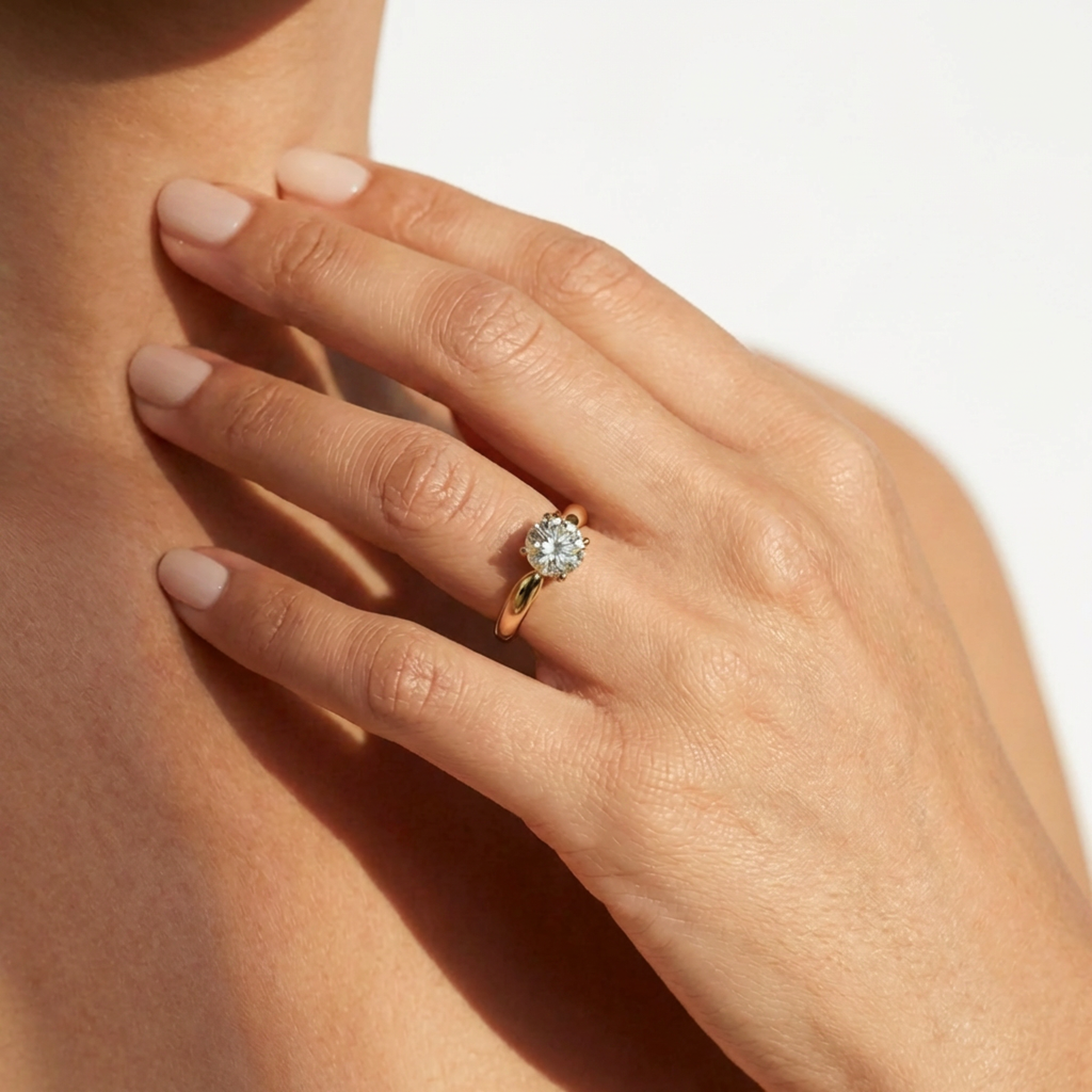Round Brilliant Diamond Solitaire Engagement Ring with 4-Claw Setting and Tapered Band