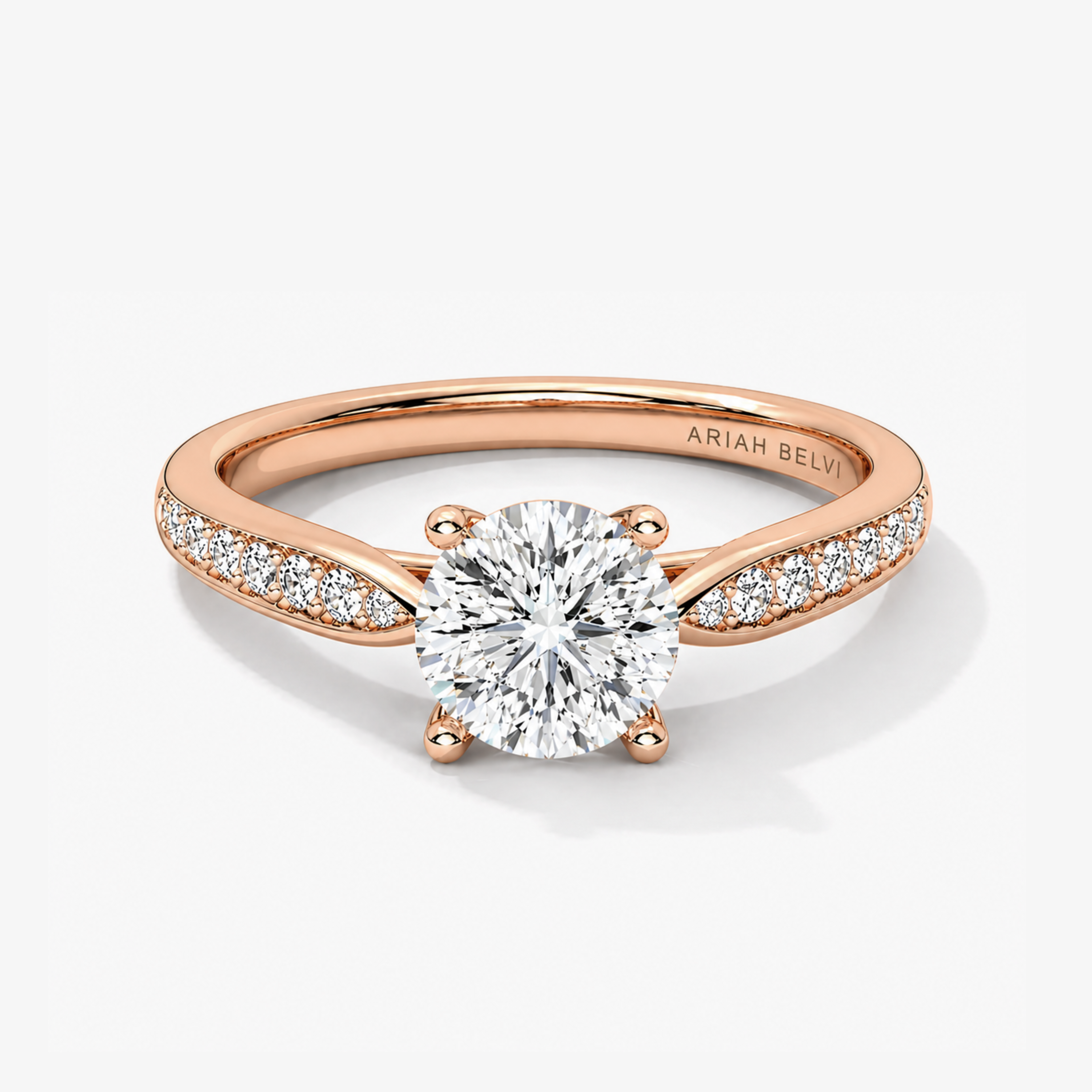 Round brilliant diamond engagement ring with pavé tapered band in rose gold