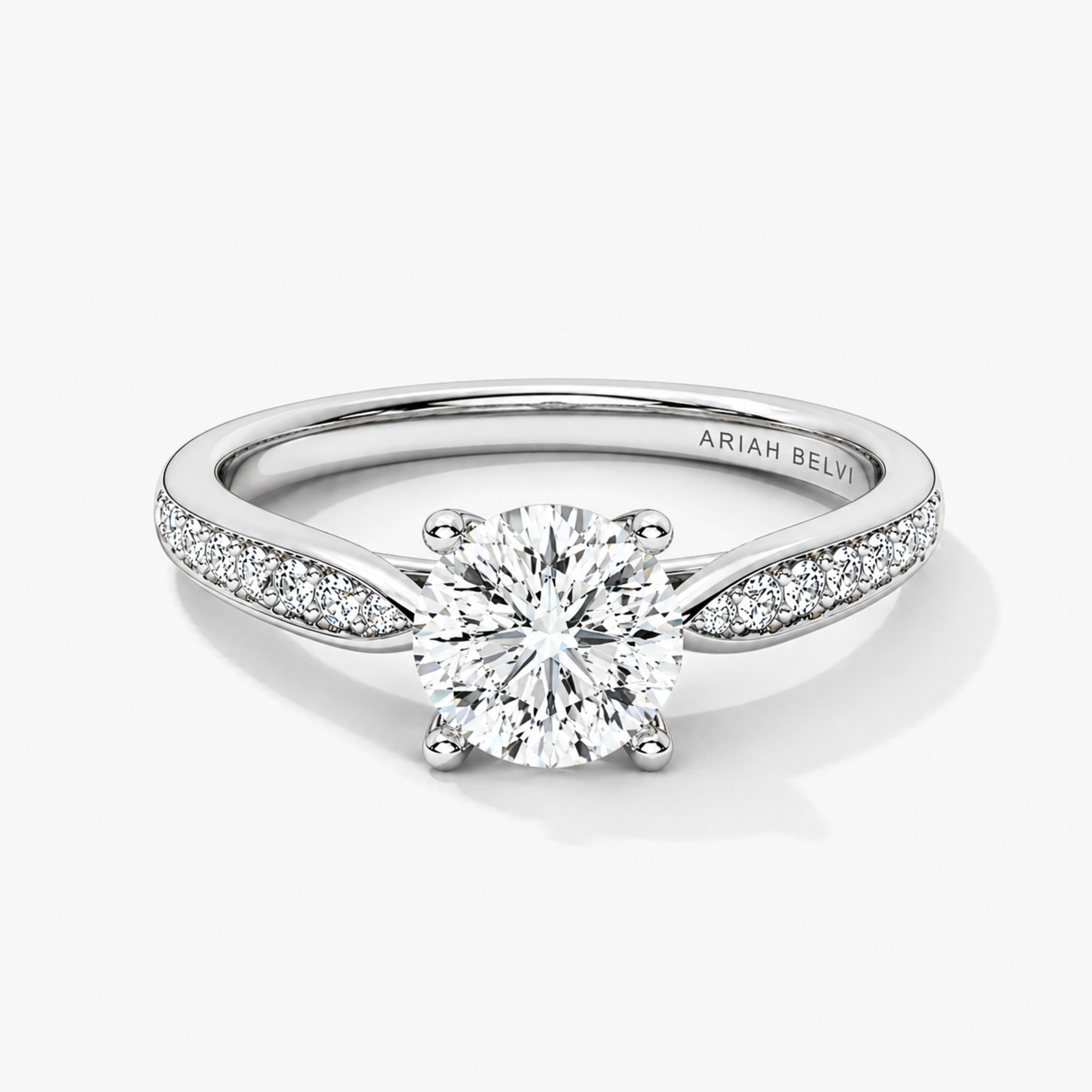 Round brilliant diamond engagement ring with pavé tapered band in white gold