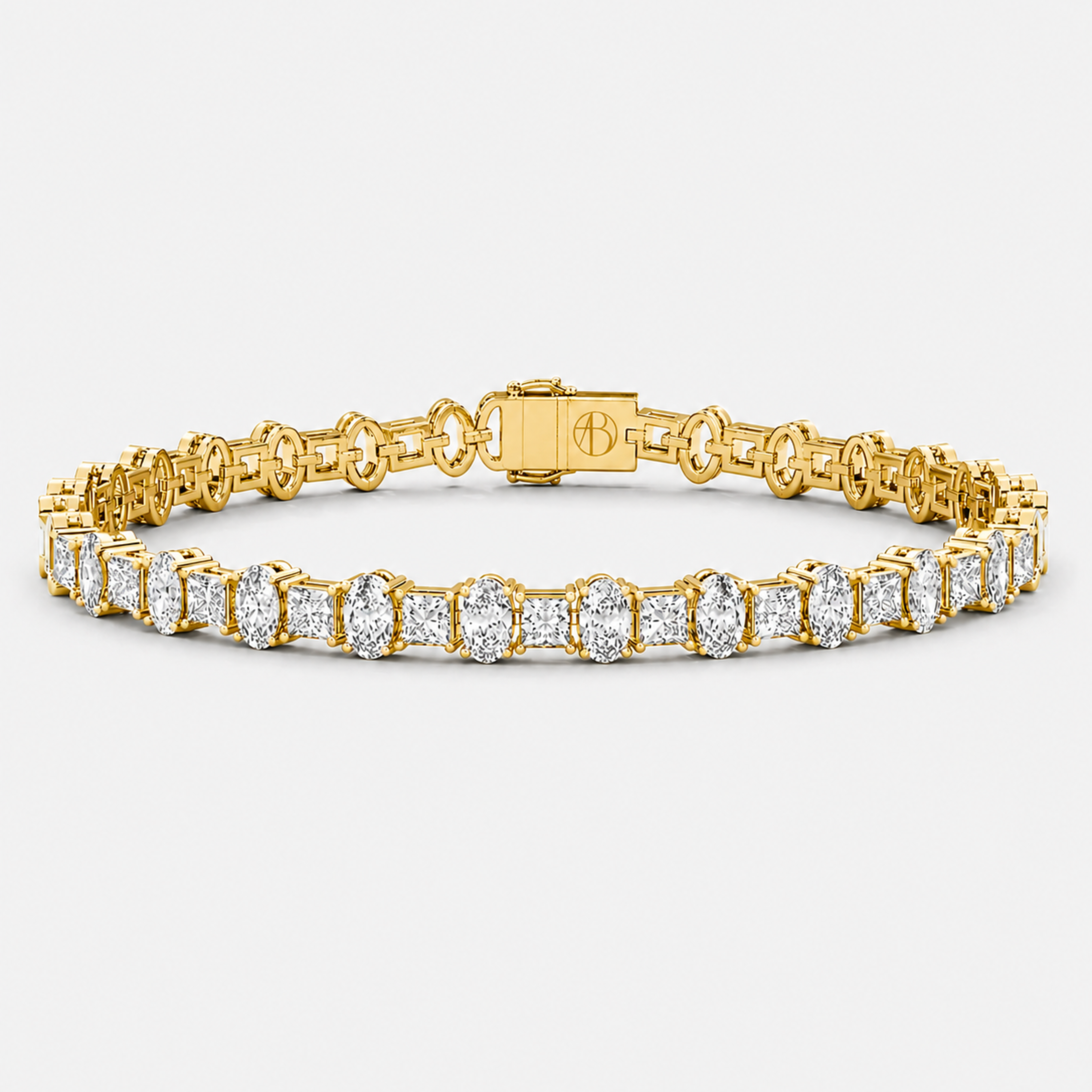 Oval and princess cut diamond tennis bracelet in yellow gold