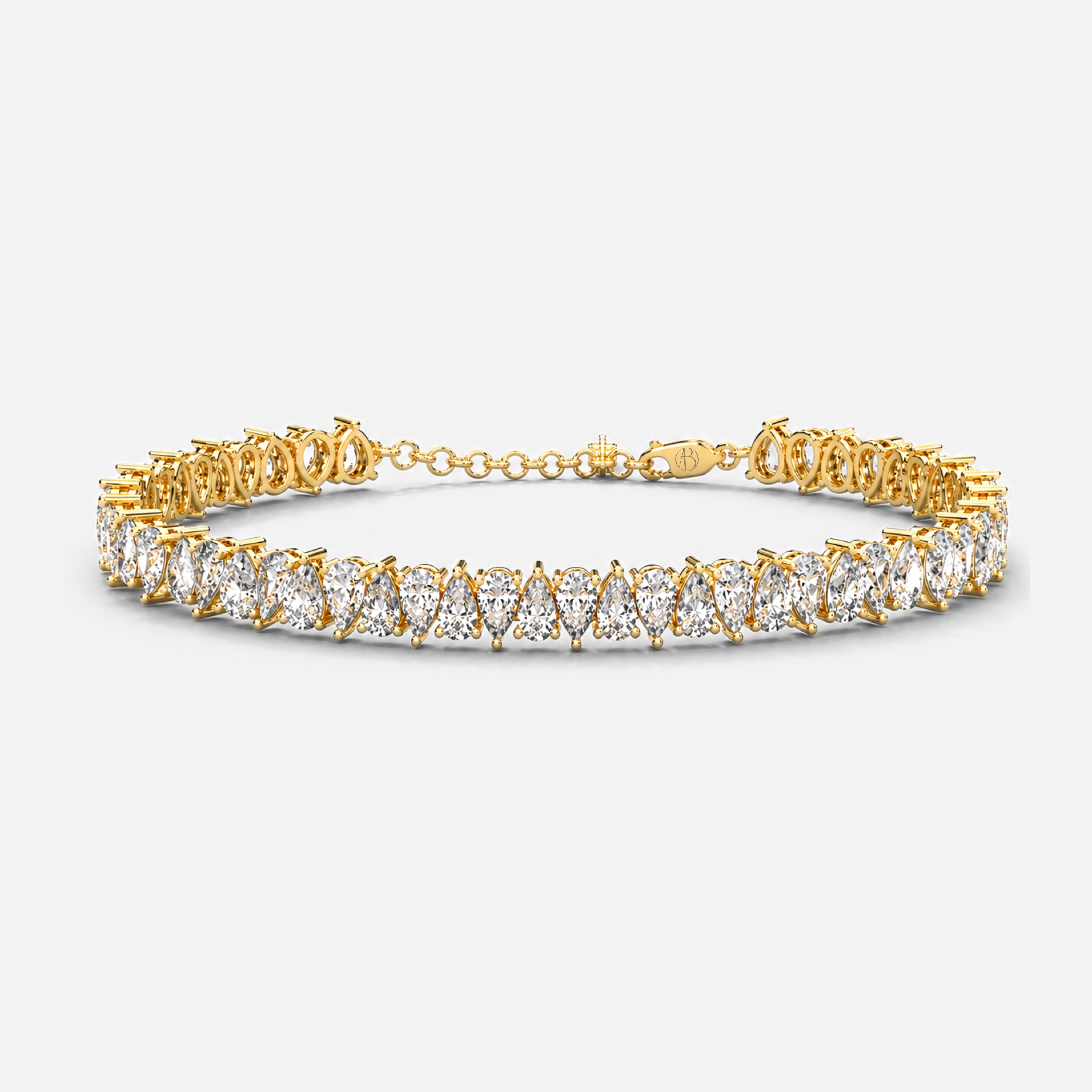 Pear cut diamond tennis bracelet in yellow gold