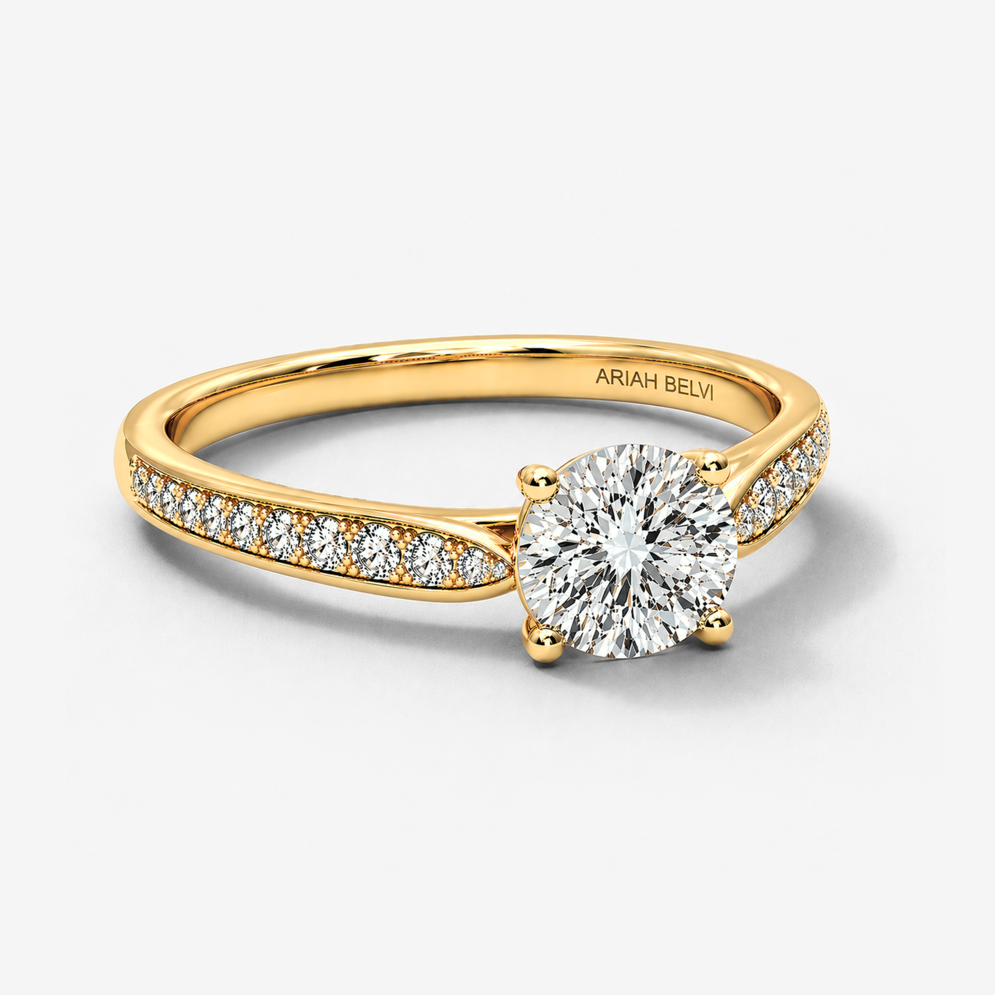 Three-quarter view of round diamond pavé tapered band engagement ring in yellow gold