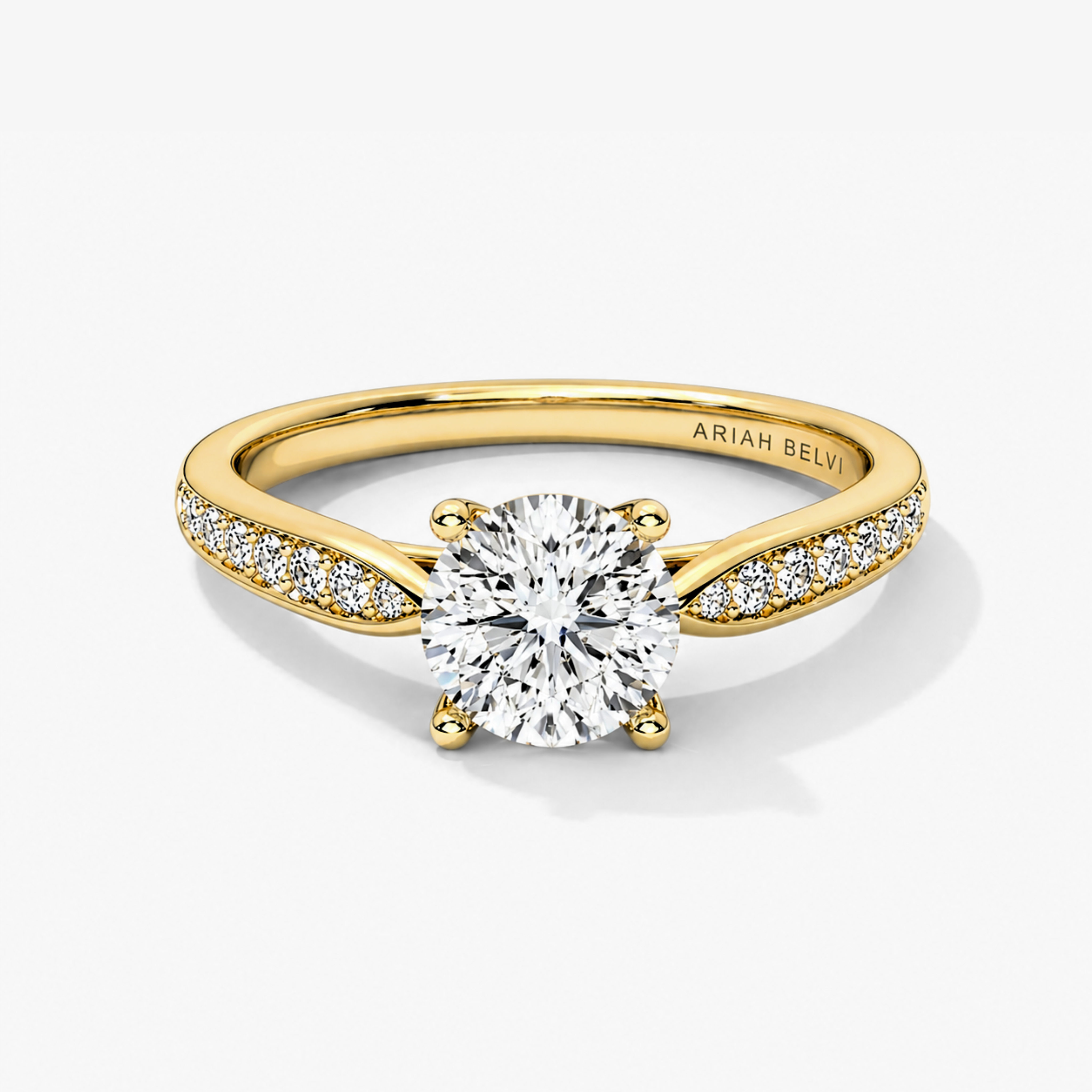 Round brilliant diamond engagement ring with pavé tapered band in yellow gold