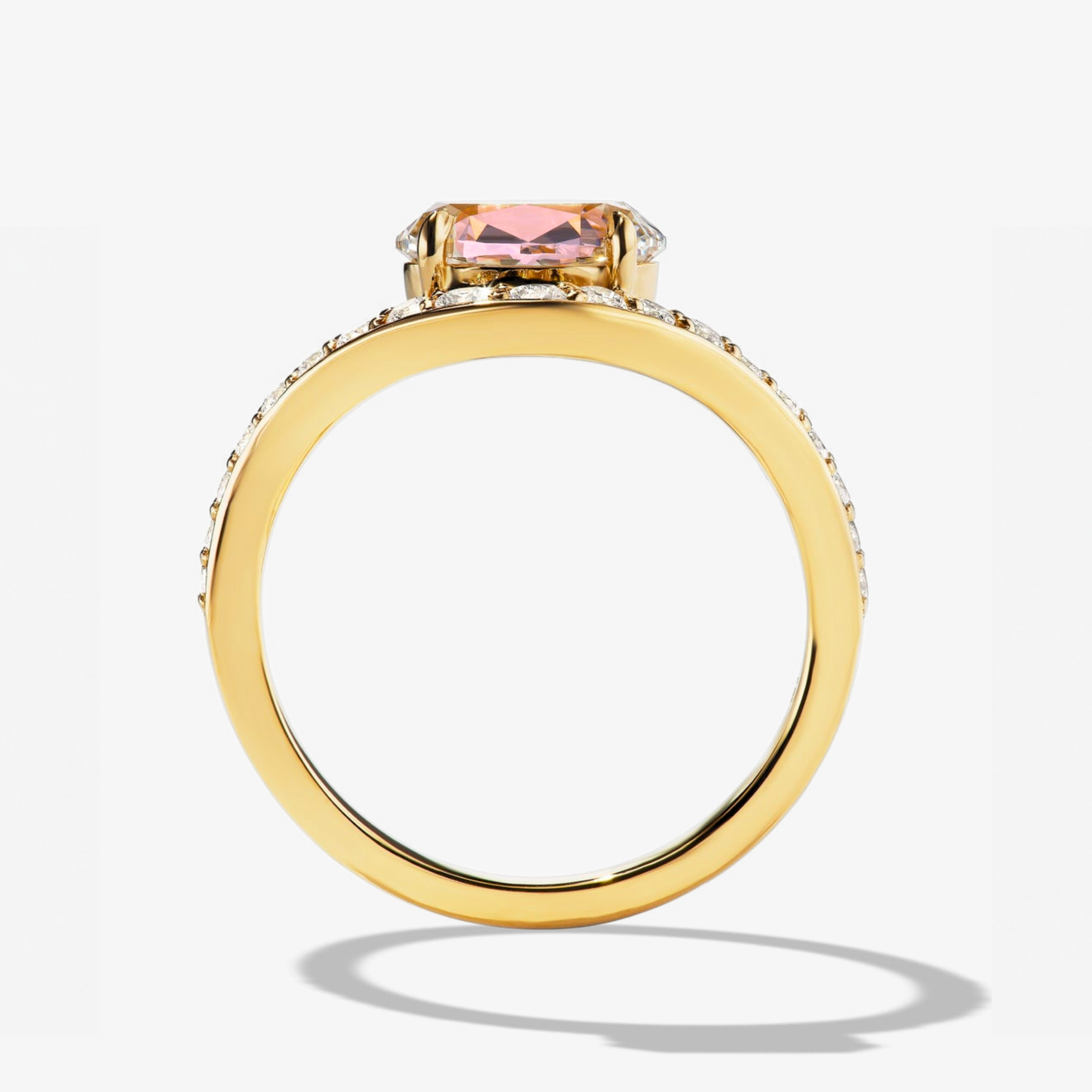 Heart cut pink tourmaline curved diamond ring in yellow gold