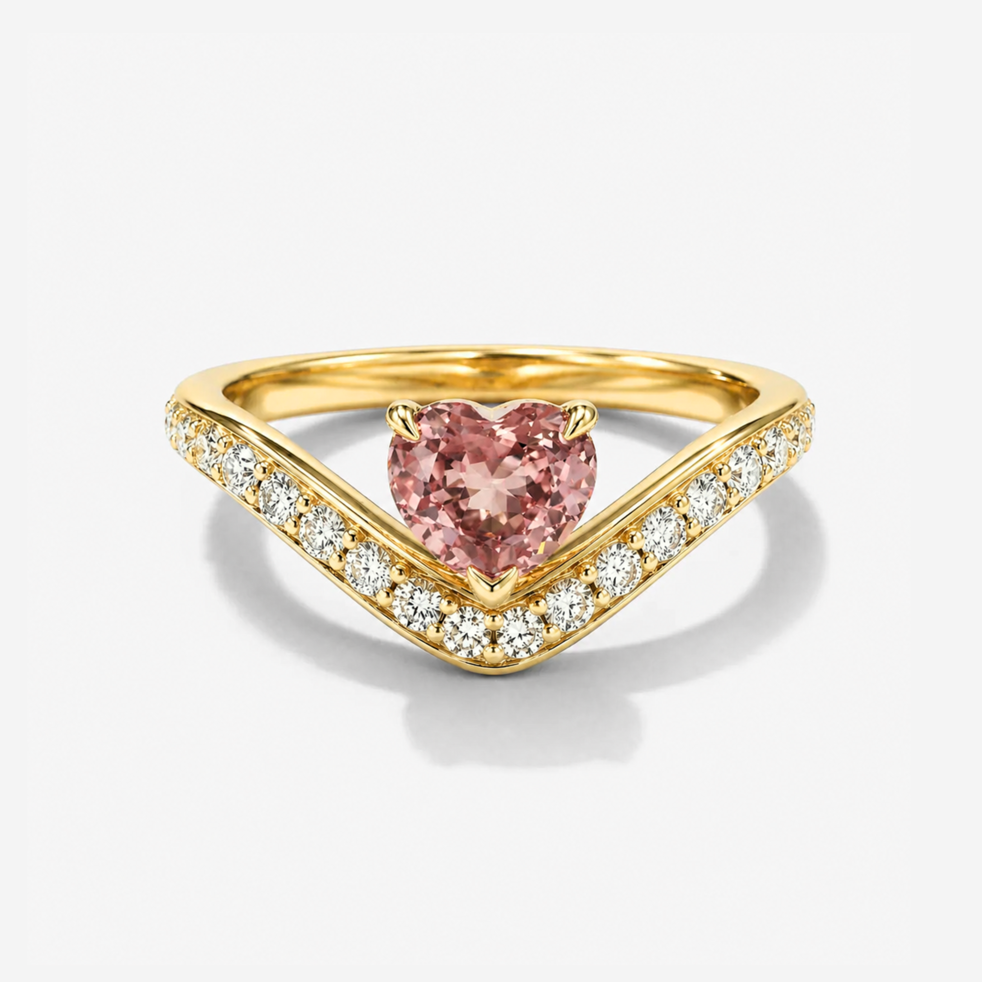 Heart cut pink tourmaline curved diamond ring in yellow gold